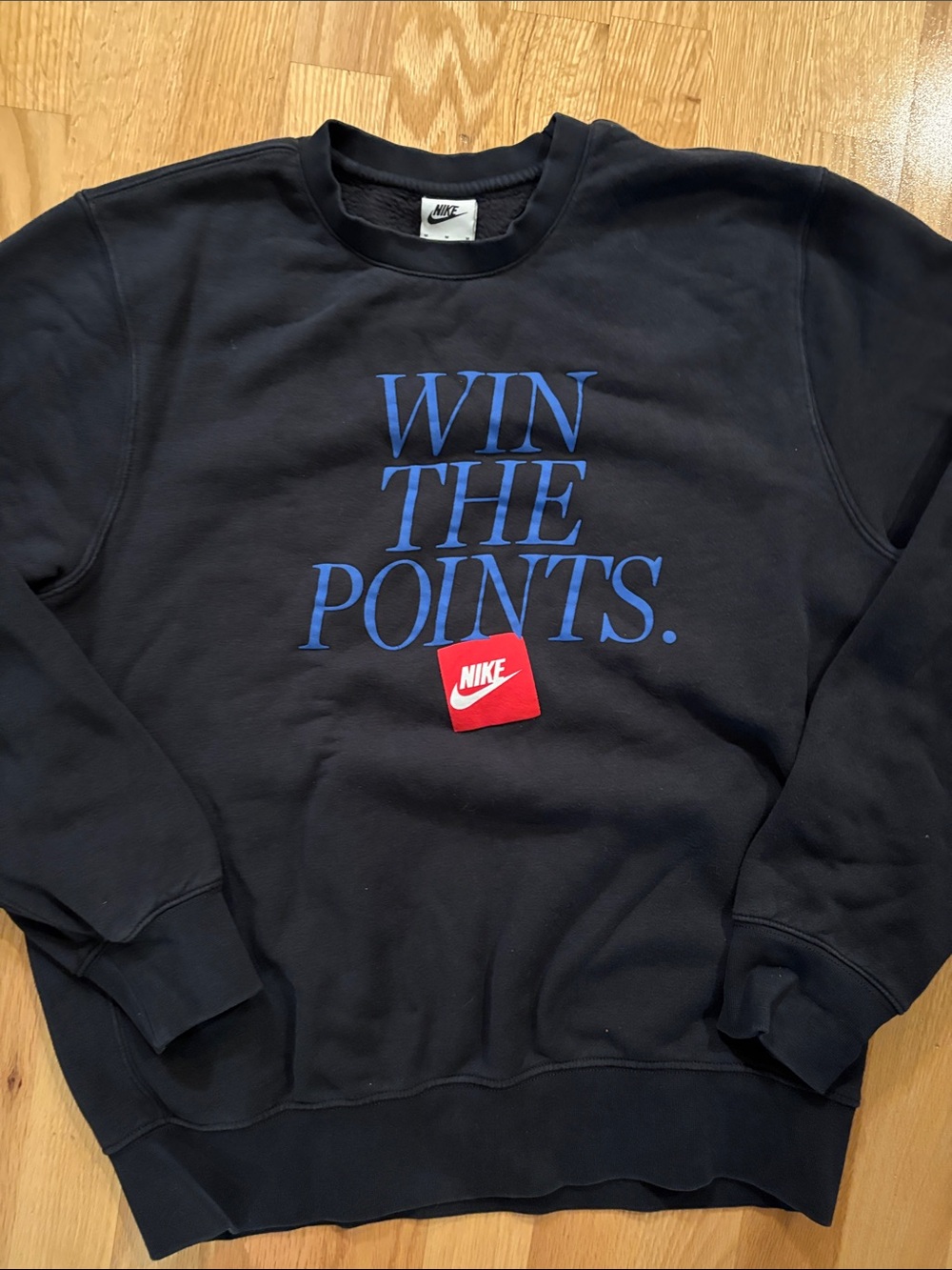 Nike Black Crewneck Sweatshirt with Blue 'WIN THE POINTS' Text